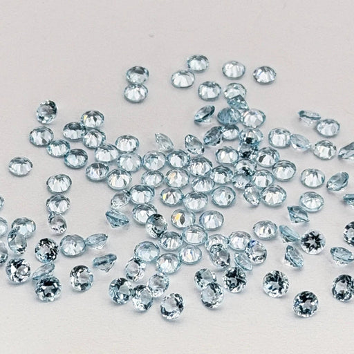 Small faceted topaz scattered on a light surface 