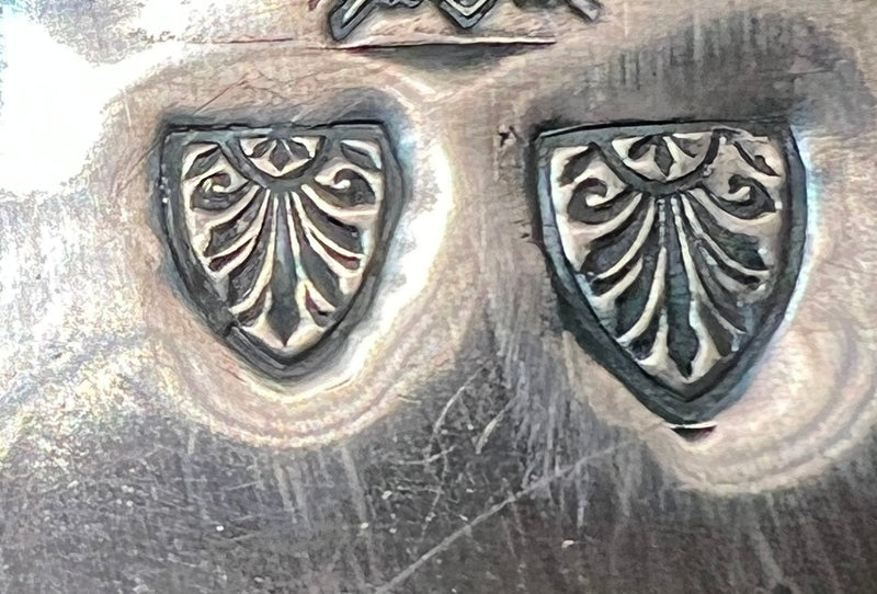 Scroll work shield (The Mitre)